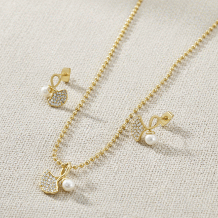 Juego de Cadena, Dije y Aretes Lazo de Perla Bañado en Oro