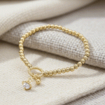 Pulsera Bañada en Oro con Dije de Corazón y Estrella – Elegancia Minimalista