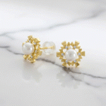 Aretes Flor de Sol con Perla Bañados en Oro