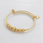 Brazalete Semanario Ajustable en Baño de Oro con Esferas