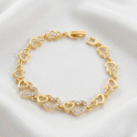 Pulsera de Eslabones de Corazones Entrelazados con Circones en Baño de Oro