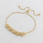 Pulsera Ajustable de Flores de Cuatro Pétalos con Circones en Baño de Oro