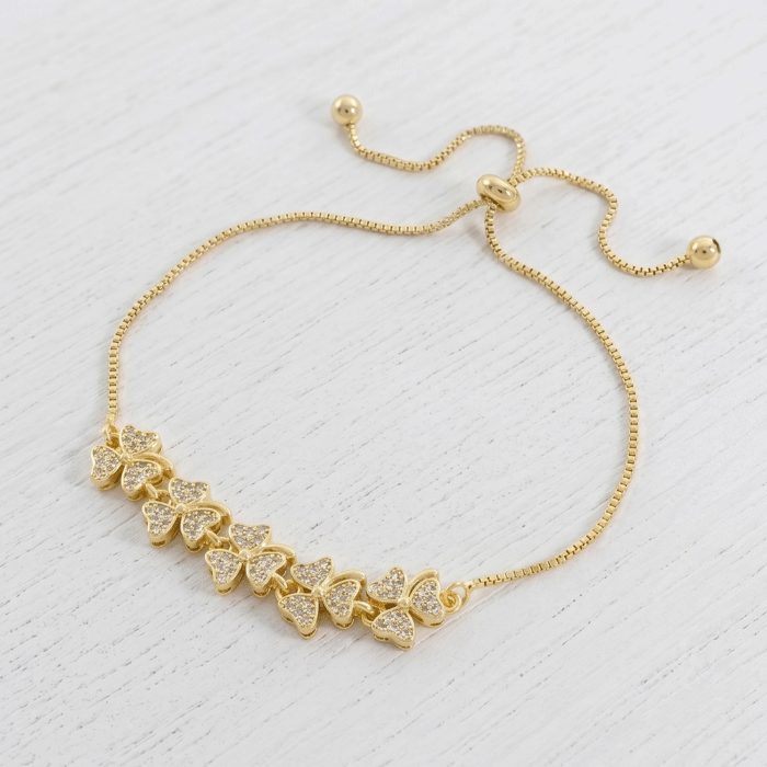 43 Pulsera Ajustable de Flores de Cuatro Pétalos con Circones en Baño de Oro - Imagen 1